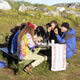 The reward, the group celebrates outside the Nanortalik Hostel