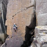 Sheena leading Red Wall, Porth Clais (Virginia Castick)