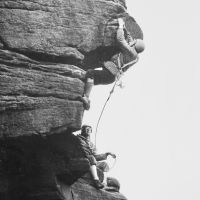 02 Bowden Black leads Hardings Superdirect Finish, Stanage (belayer possibly John Wild), early 1970s (Derek Seddon Collection)