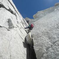 8) Dave in the lead as Duncan belays above the 'Damoclean' block, Aguja De L'S. (Colin Maddison)