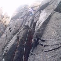 Jim on P1 of a wet Commando Ridge, Bosigran (Colin Maddison)