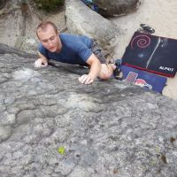 Sam balancing up a delicate slab on the Blue circuit at L'Elephant (Daniel O'Brien)