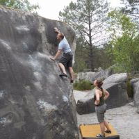 Sam wonders how best to use the tiny handholds on a 95.2 slab. (Nils Elgar)