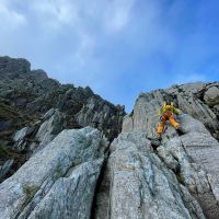 Andy weighing up the route, Bastow Buttress, Tryfan (Phoebe Marsden)